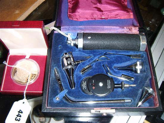 Cased medical compendium, including opthalmoscope, auriscope, etc & a BMA commemorative medallion